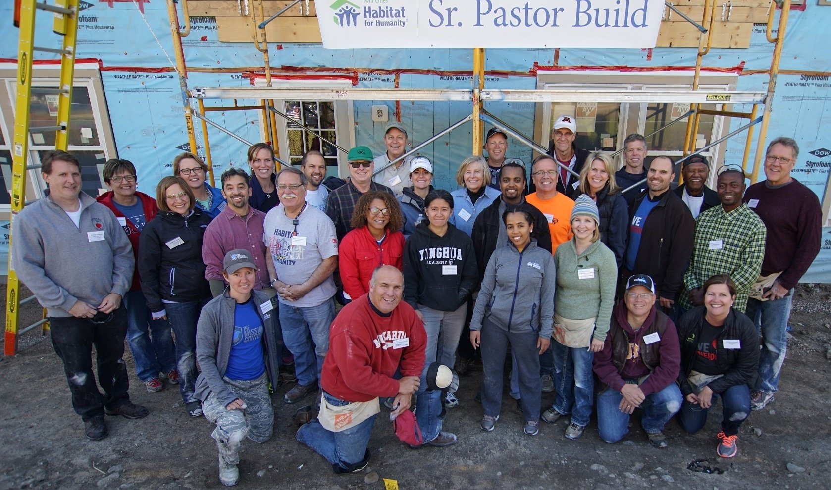 Leaders put faith into action as Habitat volunteers