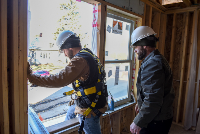 Volunteers working on windows.