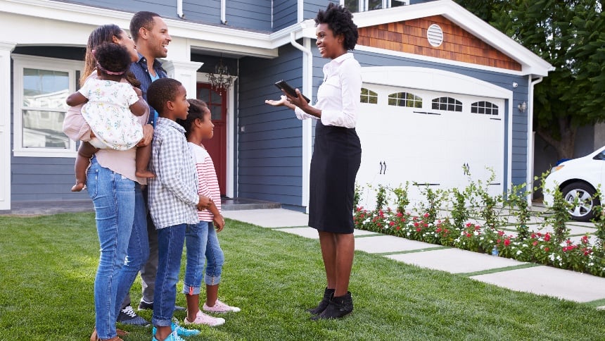 A realtor showing a family a home