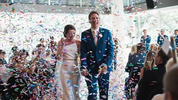 Kathleen and Kyle with confetti at their wedding.