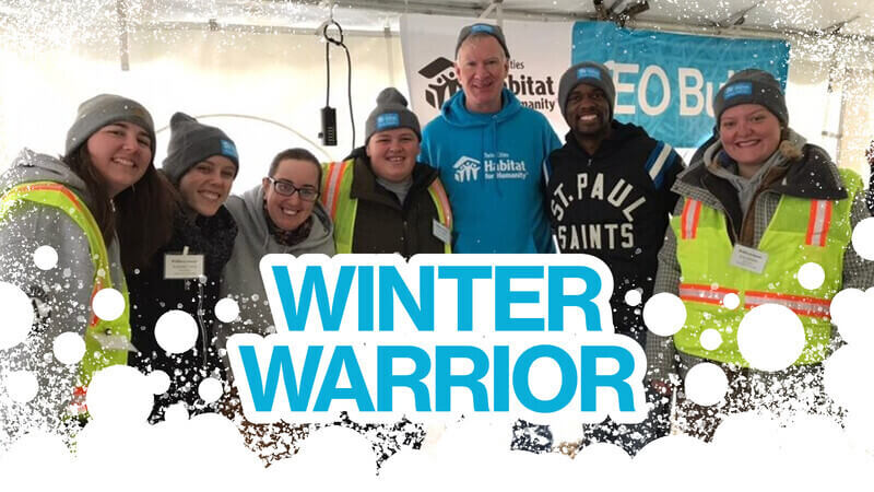Blue text reads "Winter Warrior" with an abstract snow border at the bottom. The photo behind the text is of AmeriCorps members and volunteers wearing Winter Warriors hats and posing with Chris Coleman at the CEO Build.