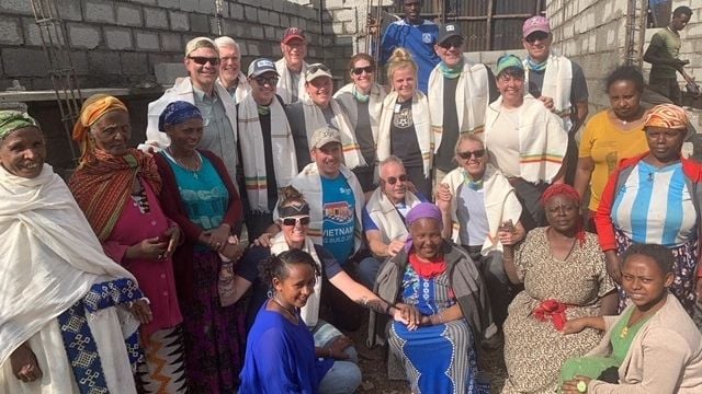 A group photo of the volunteers and homeowners in Addis Ababa.