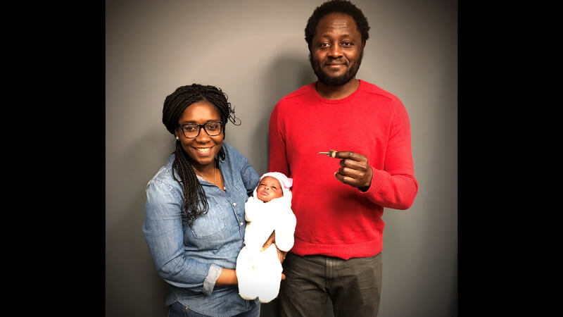 Marinette with her husband and child at their home closing.