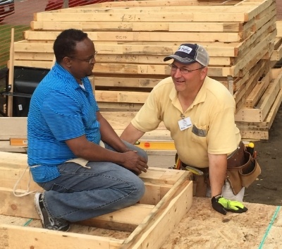 Hassan_the_homebuyer_with_a_Habitat_volunteer