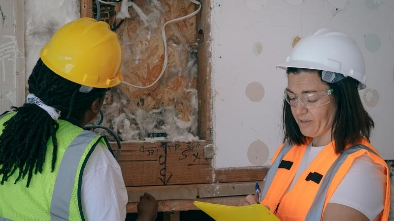 Inspection of a partially-demolished wall.