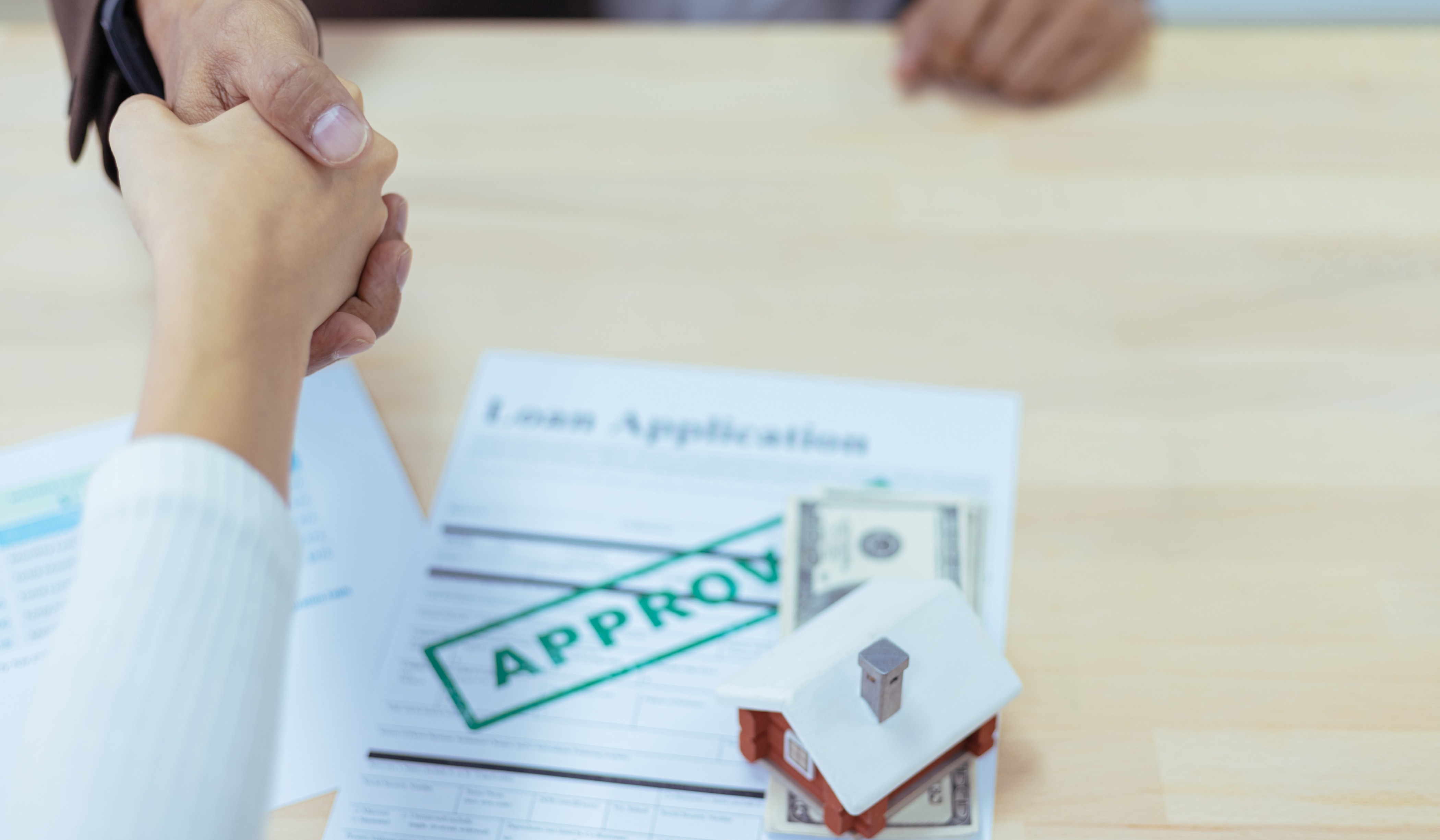 Home loan application papers with money and house 