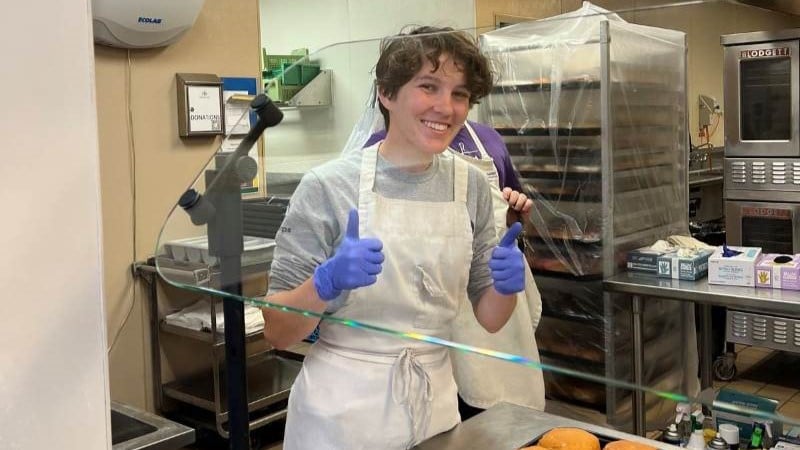 AmeriCorps Member Kate serving food during the fall service trip